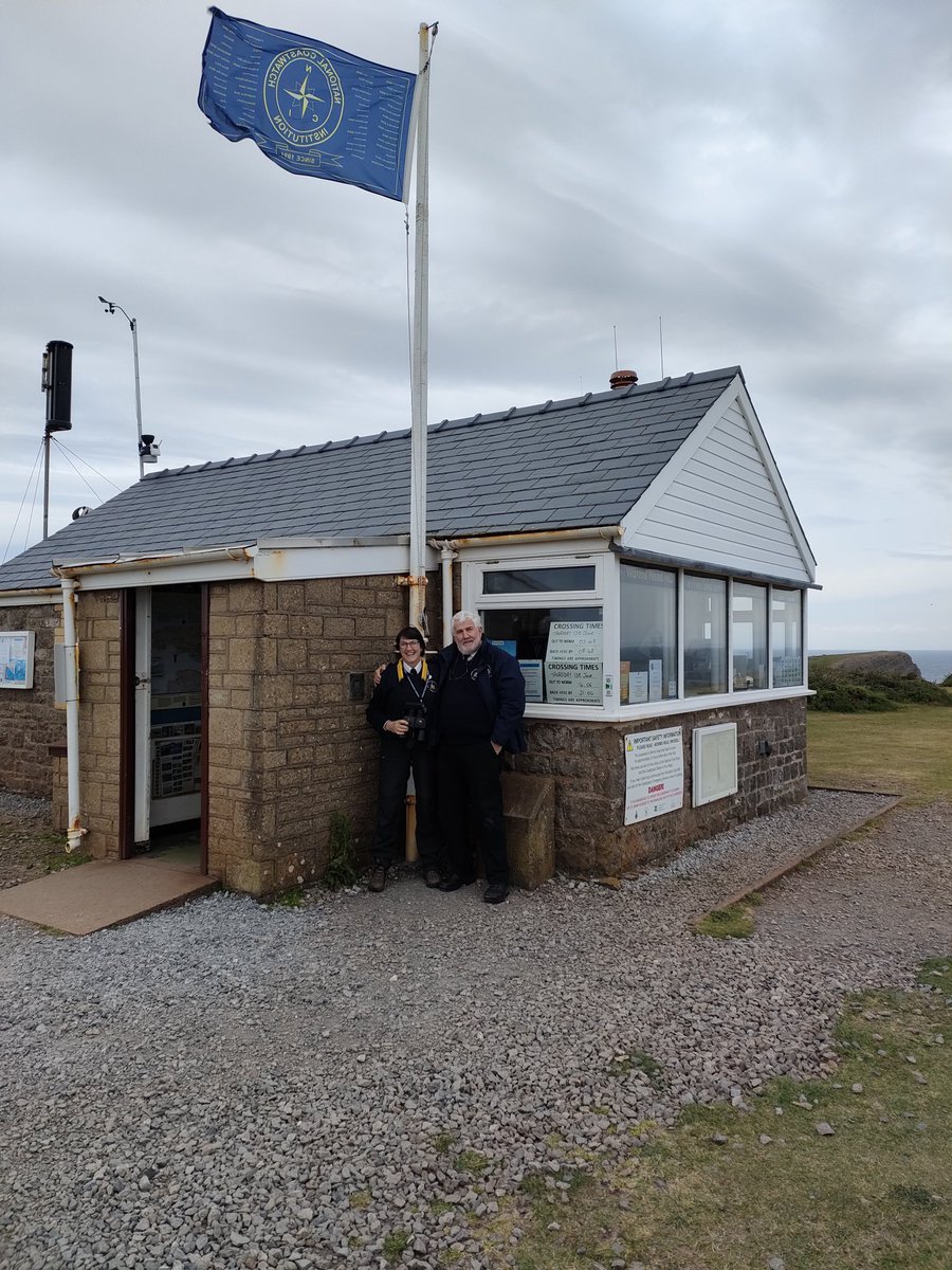 WormsHead_NCI's tweet photo. The 30th Anniversary celebratory Flag arrived at Worm’s Head with help from Station Manager Andy, DSM Jo along with Watch-keepers Ernie &amp; Janet. 
Thanks also to the unsung and ‘unphotographed’ help from JWW, ex WK Roy and Mrs Station Manager, Julie.
#onto @PorthcawlNCI https://t.co/9v8ESxjmI5