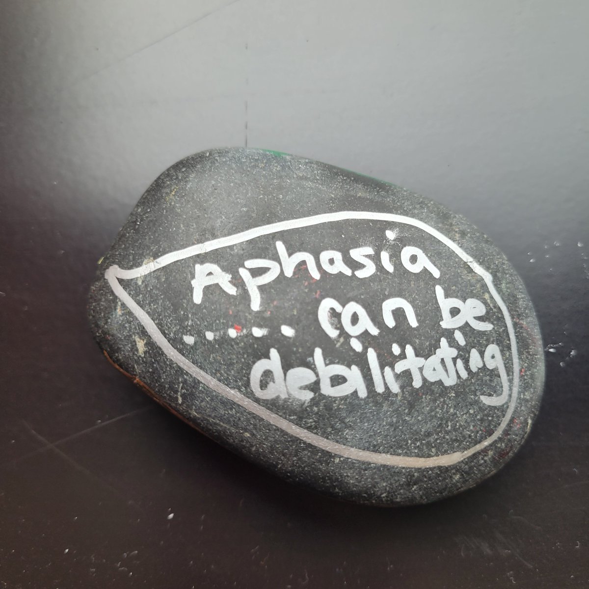 CHartleySLT's tweet photo. Another day on campus......another #rockingaphasia stone for @MyBCU and @BCUHELS staff and students to find. 
Quote from one of our conversation group members about what it is like to have aphasia. #Edgbaston 
Great to see @KellyFogarty14 also leaving a stone today! https://t.co/39W4iGDNgD