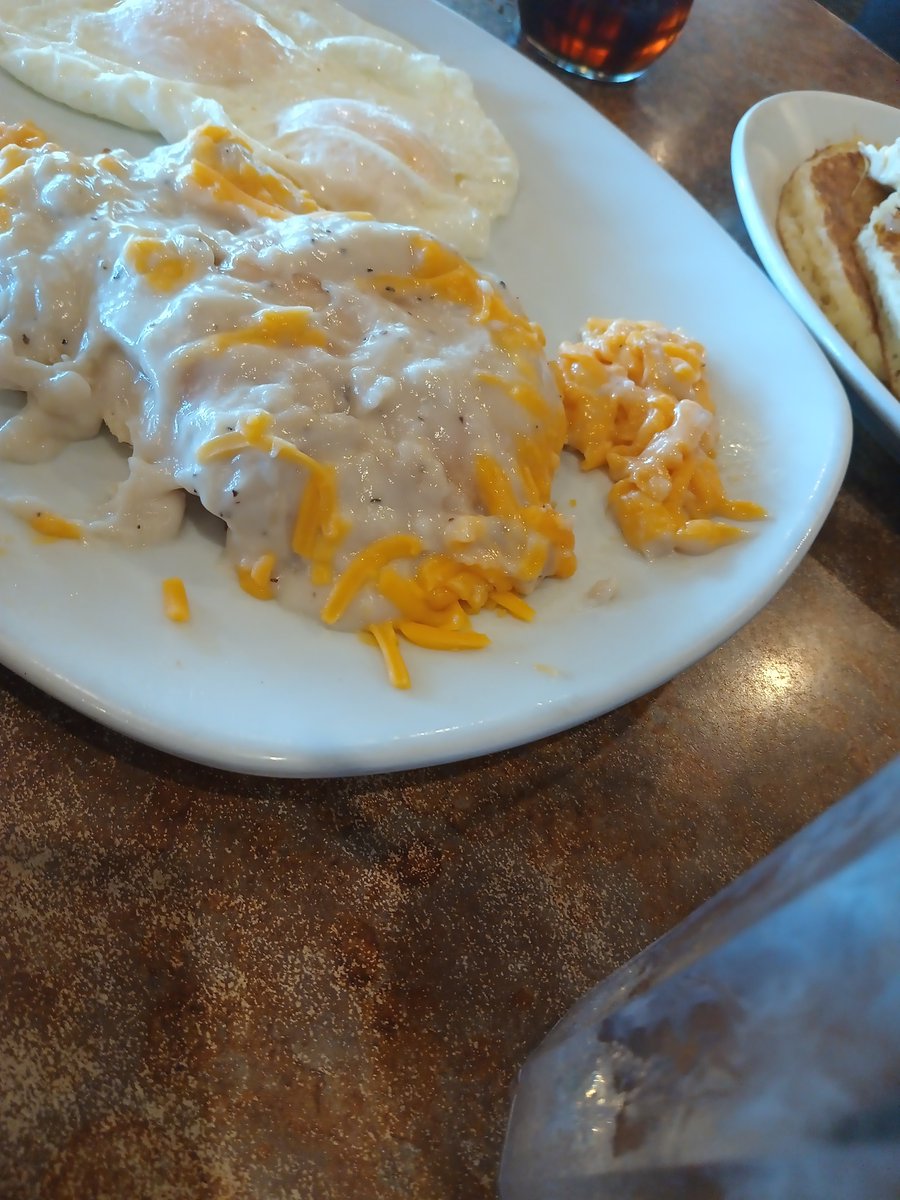 Let's get real for a minute....   Who puts cheese on biscuits and gravy? They did it to hubby's at Perkins and we've never seen that before. He scraped it all off..but why? Is this a popular thing now or something?