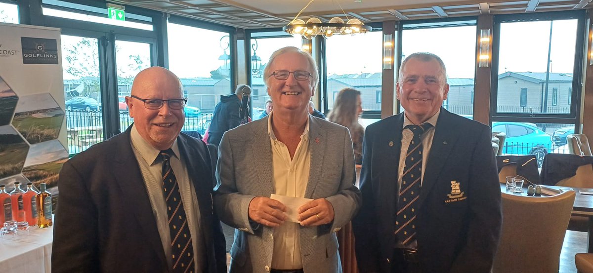 Presentation to Colin Barkley representing this year's chosen charity NI Children to Lapland.