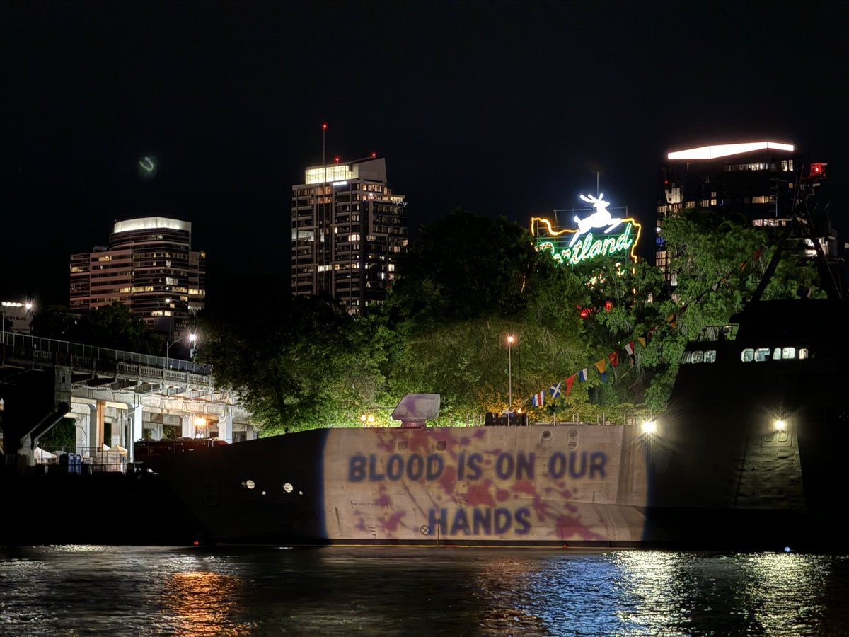 MikePrysner's tweet image. US Navy warship docked in Portland for “Fleet Week” hit with the projector gun by a group of veterans 🫡