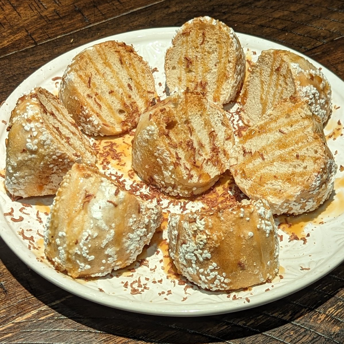 dantoth's tweet image. Salt bagel with caramel drizzle and dark chocolate shavings #WeirdBagelsByDan