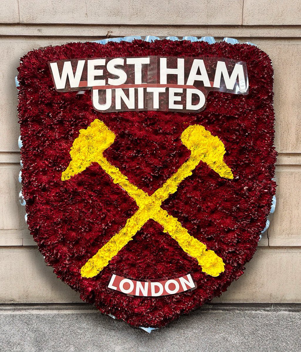 blossomflorists's tweet photo. A lovely tribute, perfect for honouring a West Ham fan’s memory. Trimmed with claret and blue ribbon, the West Ham crest stands 77cm tall. #westham #funeralflowers #essexflorists https://t.co/FnvosqNtZ1