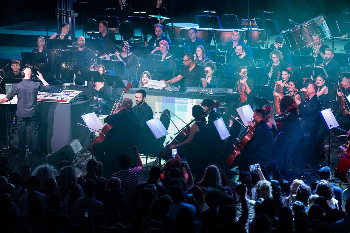 Rozafat's tweet photo. On the eve of the 25th anniversary of Kosova Liberation Day, Prishtina was living and breathing freedom.

Kosova Philharmonic performed together with Detroit techno icon Derrick May, electrifying masses in the heart of Prishtina.

#25VjetLiri https://t.co/JIi5G0y5tI