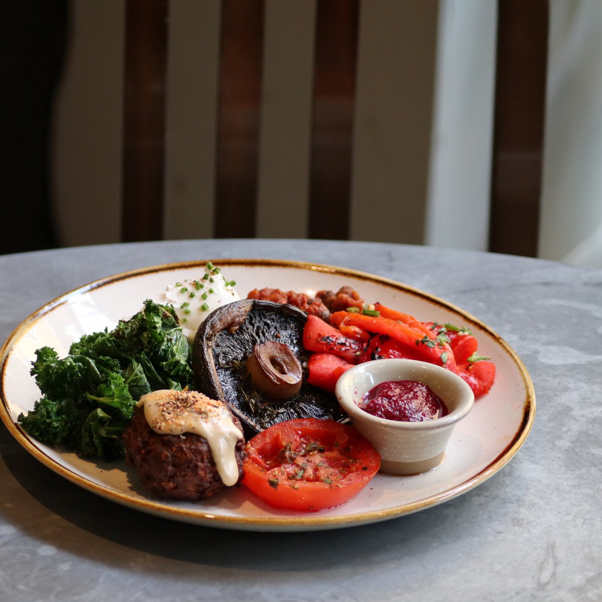 THE VEGGIE 🍄

A golden-yolked poached egg on a slice of our sourdough porridge toast with cauliflower pakhora topped with gunpowder spice mix, buttery thyme roasted mushroom, red peppers, rosemary tomato, our house beans &amp; a stack of garlicky locally grown &amp; seasonal greens.