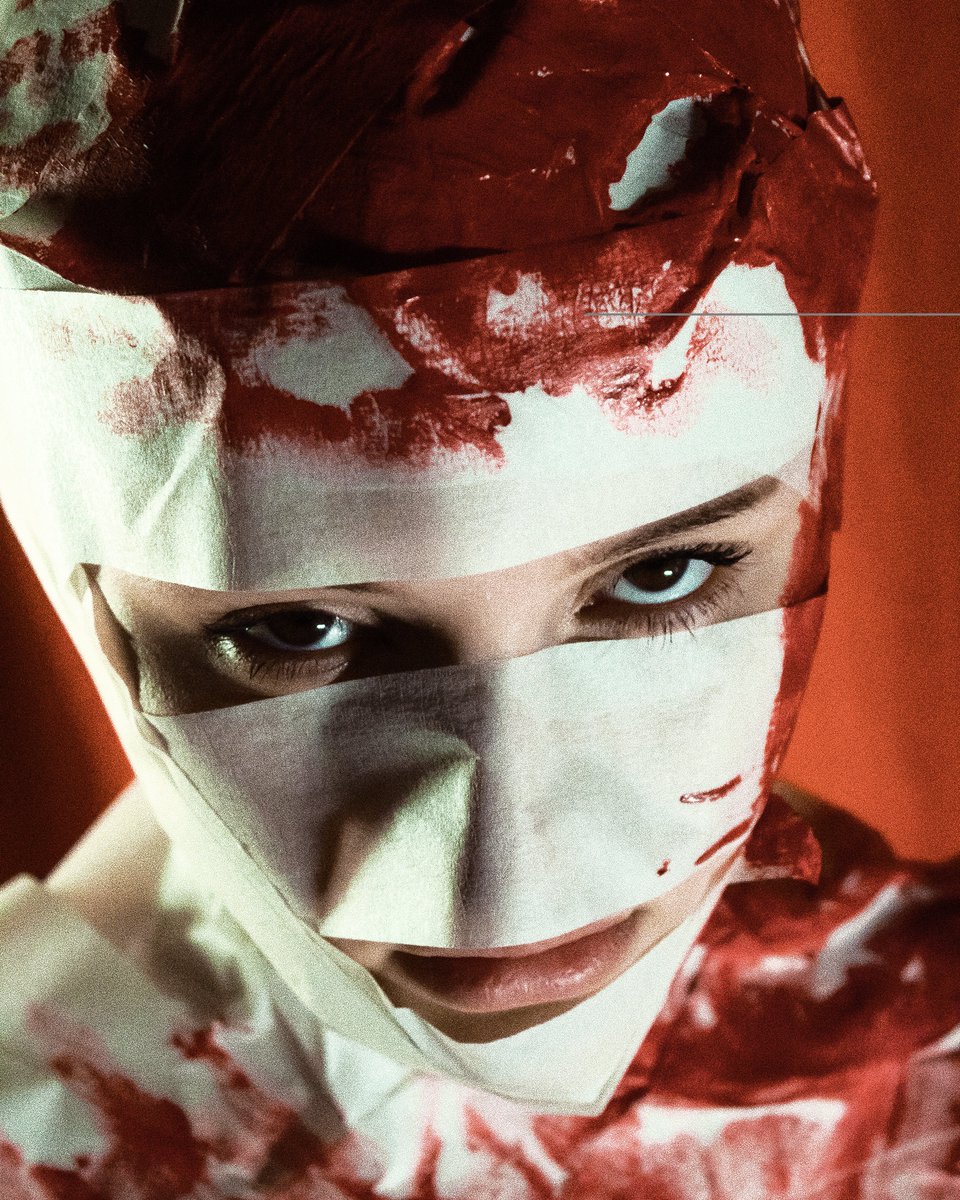 Gm 🤍

"The sixth piece is 'Facing Hardships'. In this photograph, Yana's face is shown in close-up, wrapped in bandages. Her intense gaze into the camera reflects determination and resilience in the face of life's challenges."