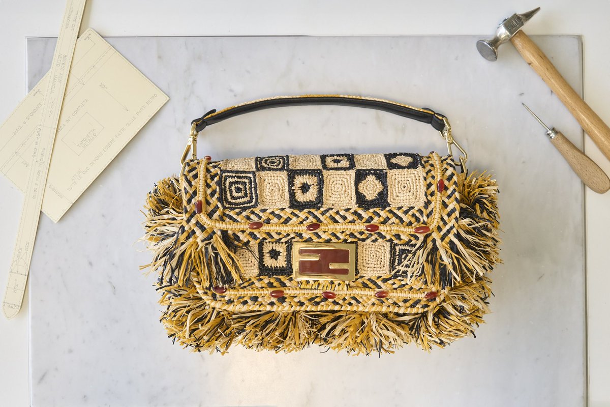 Fendi's tweet photo. The Maison is proud to present its latest Hand in Hand #FendiBaguette created with Made For A Woman in Madagascar.
Conceived across Italy in 2020 and expanded worldwide to the USA, Japan, China, and Scotland, #FendiHandinHand is a grassroots partnership between Fendi and local artisans that celebrates the #FendiBaguette by Artistic Director of Accessories and Menswear Silvia Venturini Fendi as an icon of the Maison and an instantly recognisable canvas for perpetual transformation.
The Baguette crafted by Made For A Woman reinterprets traditional Malagasy designs into an intricate pattern of different stitches. Working with locally sourced raphia, the artisans created the bag from four different crochet squares tied together, outlined by three-toned raphia with fringed edges. A macramé braid runs over the Baguette, its flap and shoulder strap, embellished with exquisite carnelian beads.