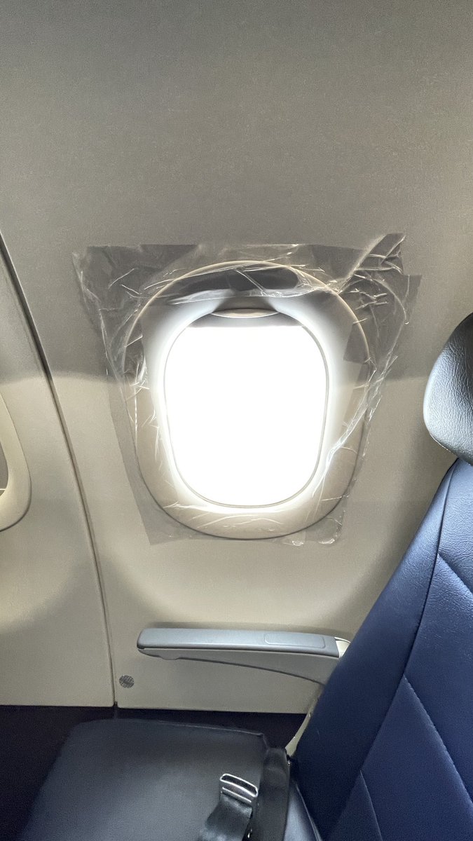 CraigSetzer's tweet photo. Hope the taped up airplane window in my row is not integral to the operation of this ⁦@AmericanAir⁩ flight back to Miami https://t.co/1pZEE9fqaG