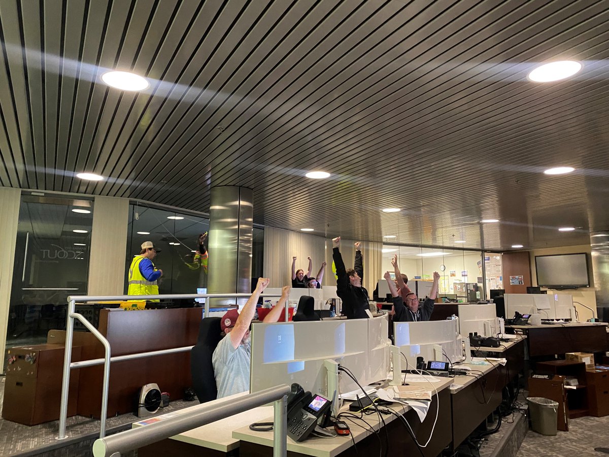 MoDOT_KC's tweet photo. KC Scout staff celebrate as first electronic message board tests prove successful. If all testing is successful, real-time information should return to the boards in the next week. #kctraffic #kcscout #MoDOT #kdot https://t.co/0jpTCk9MpV