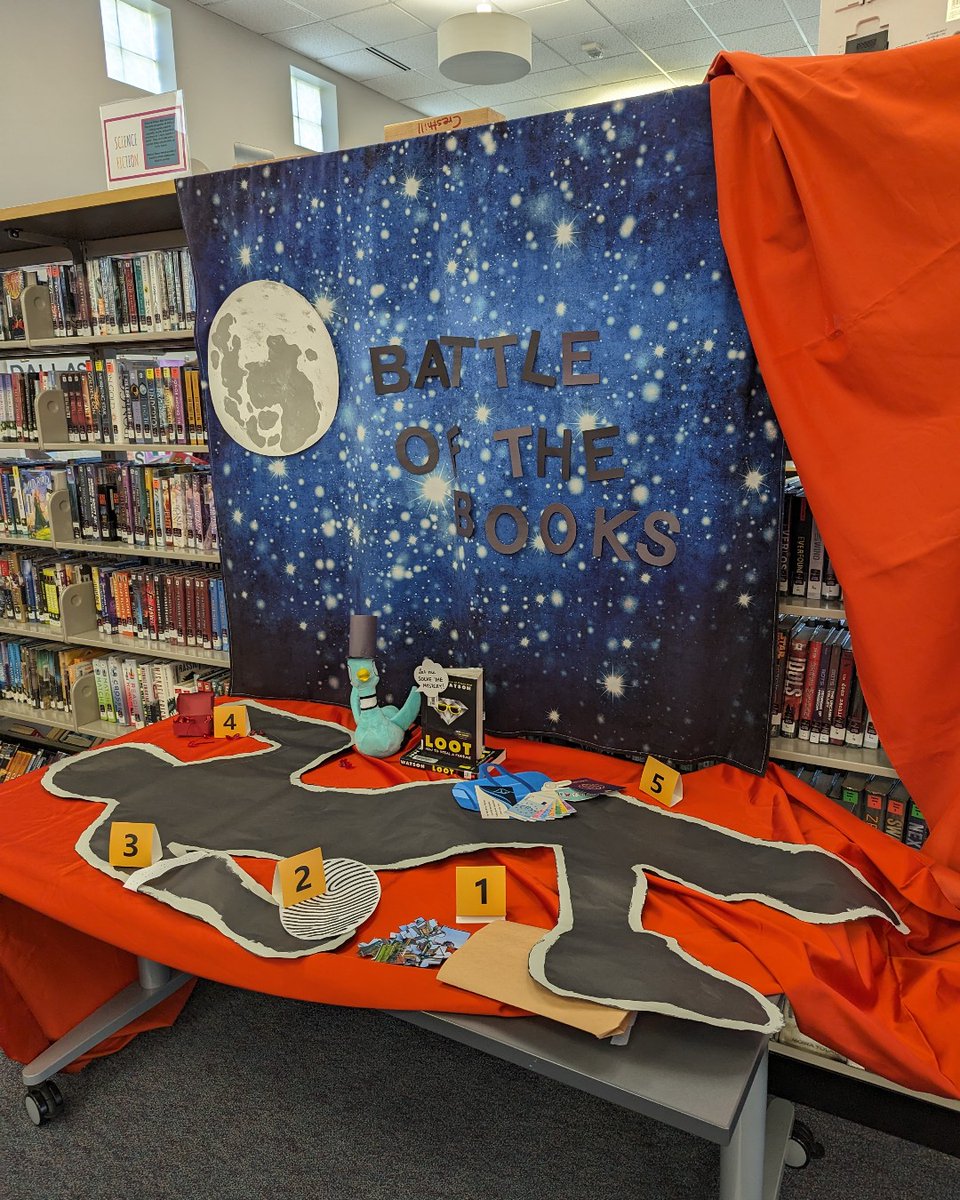 Our <a href="/dcsdk12/">Douglas County School District</a> tour continued in the library of Cresthill Middle School where <a href="/The_Pigeon/">The Pigeon</a> did some detective work to solve the Battle of the Books escape room mystery. The Pigeon did ciphers, puzzles, word scrambles, and even used a black light to find hidden clues!