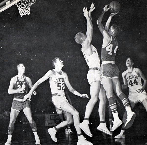 Allen Feldhaus of the UK  Wildcats guards the iconic Jerry West of West Virginia 
 Jerry West the great NBA player and the NBA logo is modeled after Jerry West. Jerry West passed away today at the age of 86