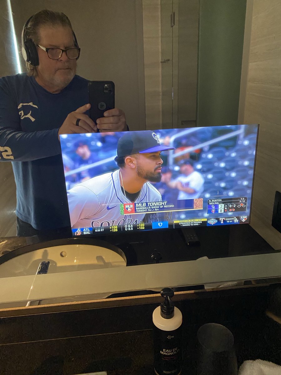 JohnKruk's tweet image. TV built into the mirror in the bathroom. Who knew
