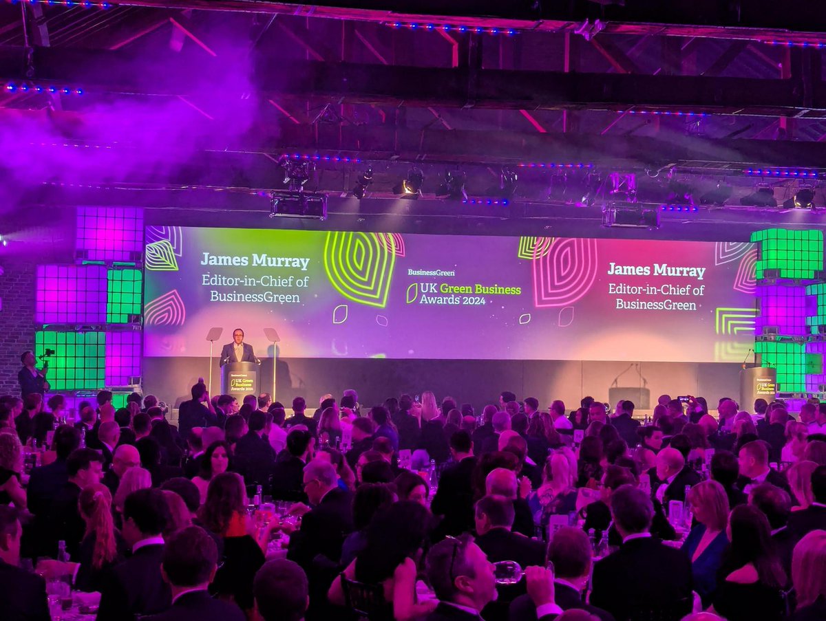BusinessGreen's tweet photo. @James_BG takes to the stage at the #UKGBA to give his opening speech. 
"The ambition evident in #London’s #climateplans underscore how we are at an inflection point in the #netzero transition - a turning point that means the work of you and your colleagues is becoming even more important."