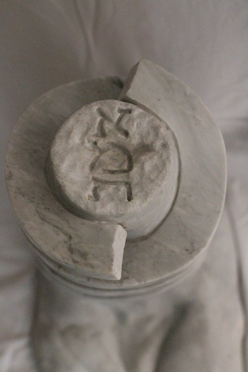 GreenGolemMag's tweet photo. “Golem DNA” by Hal Goldberg

The double helix DNA of the Golem is now preserved in marble, and will re-create a new Golem whenever the Jews are in jeopardy.  On the top of the double helix is carved the word “Emet”, “truth” in Hebrew.

In the original story of the Golem of Prague, the Golem was activated by inscribing “Emet” on its forehead. To deactivate the Golem, the letter aleph was removed, transforming the word “truth” to the word “death”.

(2001) White Carrara Marble 17" x 11" 13"

Hal has been a marble sculptor for over 50 years. He studied at the Laguna College of Art and Design (Laguna Beach, California)  and at the Art Students League (New York), but is primarily self-taught. He carves directly in the stone.

The purpose of Hal's sculptures is to make people think long and hard about the Holocaust. The sculptures are dedicated to one of the most important lessons of the Holocaust - Am Yisroel Chai - the Jewish people will always survive.