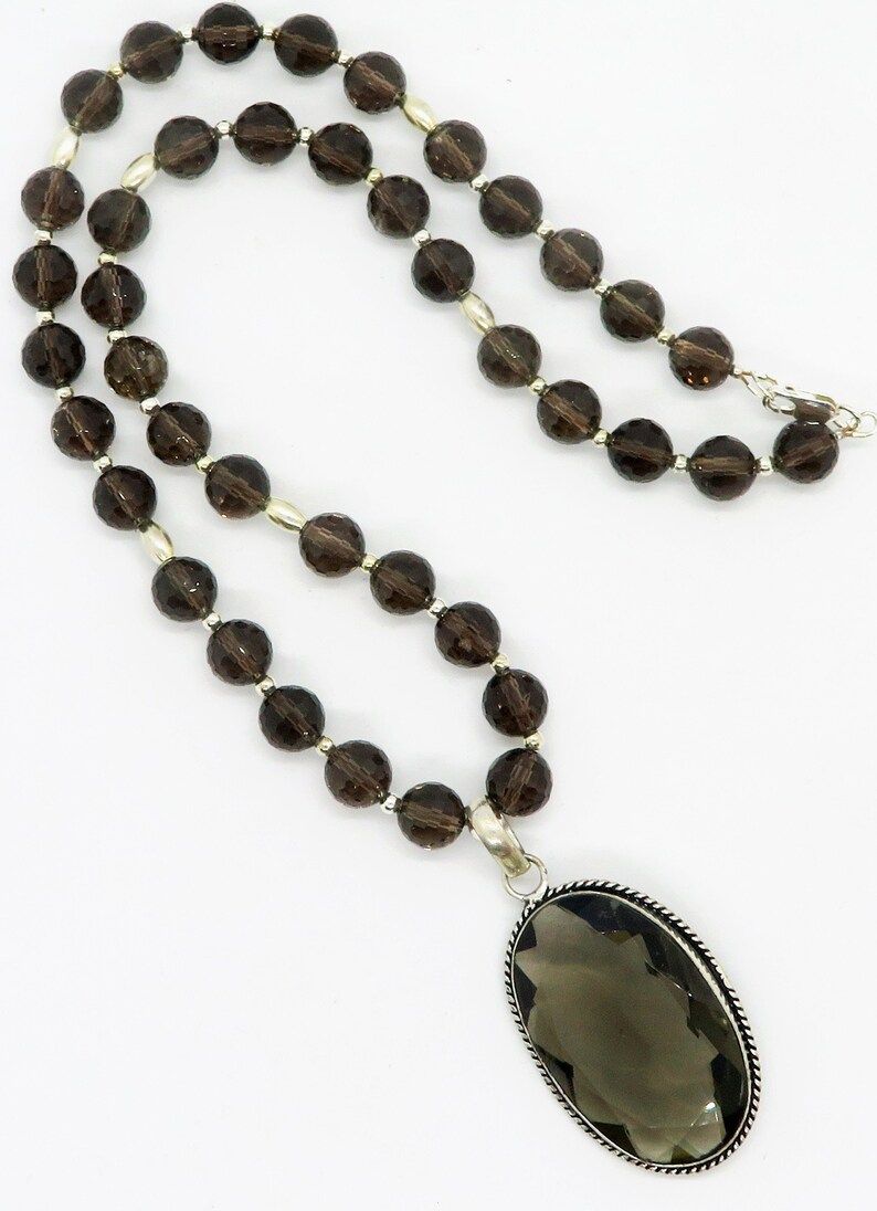 ExoticTreasure1's tweet image. 'Stunning Smoky Quartz Sterling Silver Pendant Necklace for November birthdays. Handcrafted by RivendellRocksSedona, this piece is elegant, precious, and extraordinary. #NovemberBirthstone #Jewelry' buff.ly/4aTIaam