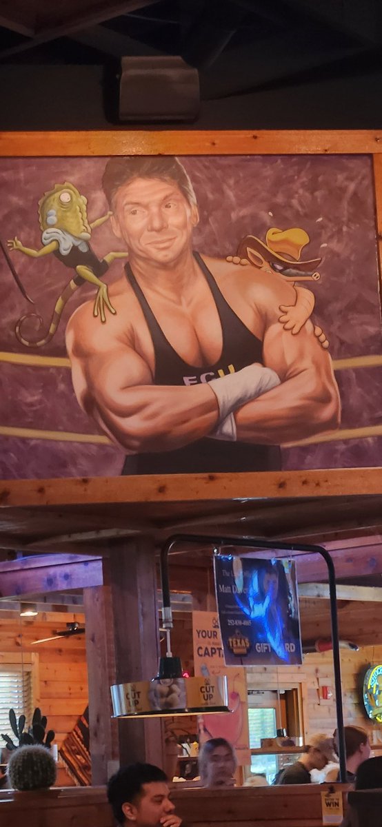henri_zevin's tweet photo. @bullyray5150  the bartender said "It's not an ECW shirt....its an ECU shirt, he went here. But he's in a ton of trouble so we don't know how long it will be up" https://t.co/Jxa4bN59Th