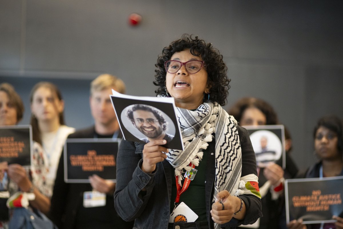 LossandDamage's tweet photo. 🚨ACTION ALERT 🚨: Powerful testimonies on the persecution of #HumanRights and #ClimateJustice  warriors echo through the hallways of the #BonnClimateConference on the last day of discussions. ✊

🗣️"There can be no #ClimateJustice without #HumanRights! #FreeThemAll!" https://t.co/9tjwt1vkh2