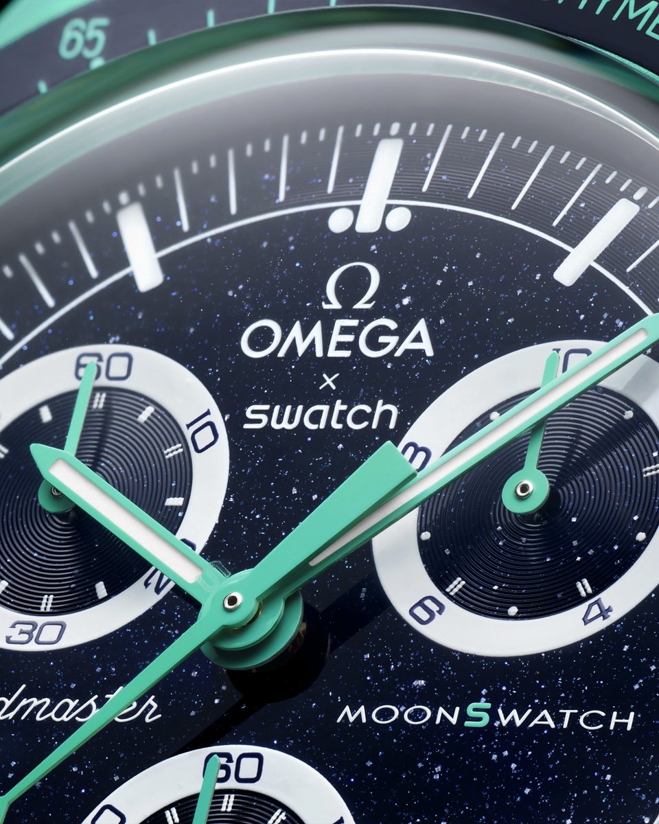 Swatch's tweet photo. MISSION ON EARTH – POLAR LIGHTS Bioceramic case, dark blue dial inspired by aventurine glass and two-toned subdials celebrating iconic OMEGA Speedmaster models. Available from June 15 in selected Swatch stores worldwide. #MoonSwatch #OMEGAxSwatch #Swatch https://t.co/8N1mdV9ACs https://t.co/NLNSNMIhEE