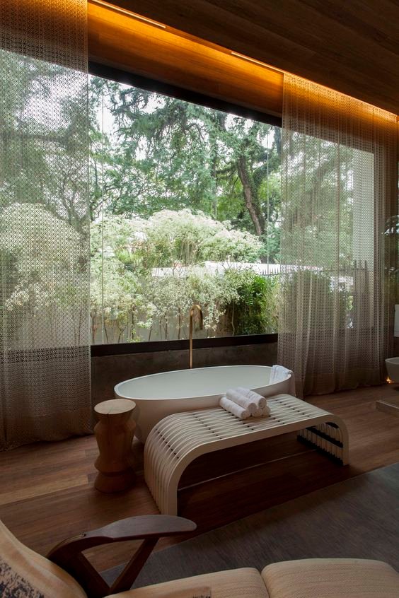 johngoslett's tweet image. With a wealth of timber and verdant forest views, this beautiful bathroom has an tranquil, spa-like feel. #BathroomDesign #SpaVibes #NaturalMaterials