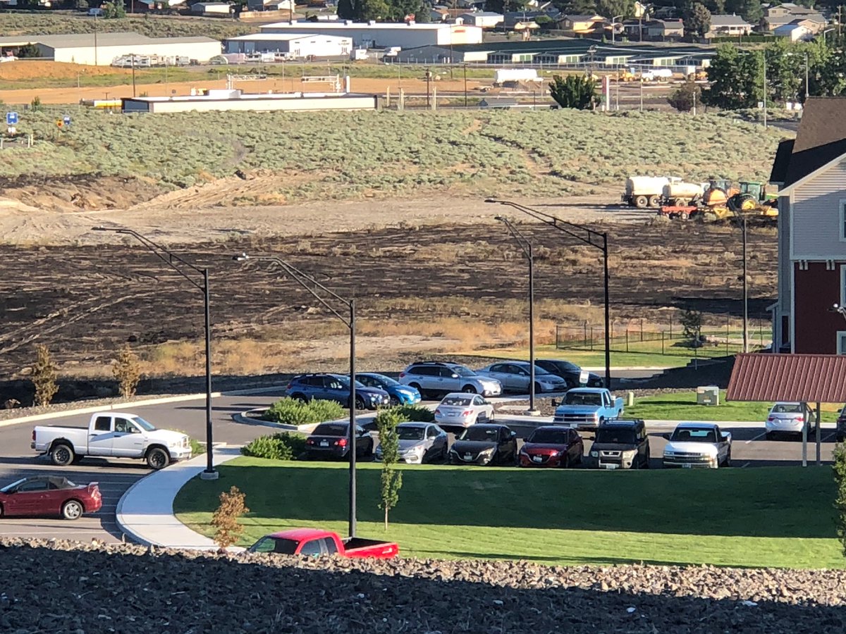 KennewickChief's tweet photo. Does defensible space really work when it comes to keeping buildings safe from wild land fires?  You bet it does.  KFD received the benefit of this a few days ago when a wild fire occurred near the Badger Canyon Apartments.  No vegetation near the buildings played a key role. https://t.co/B1tmeeWiND