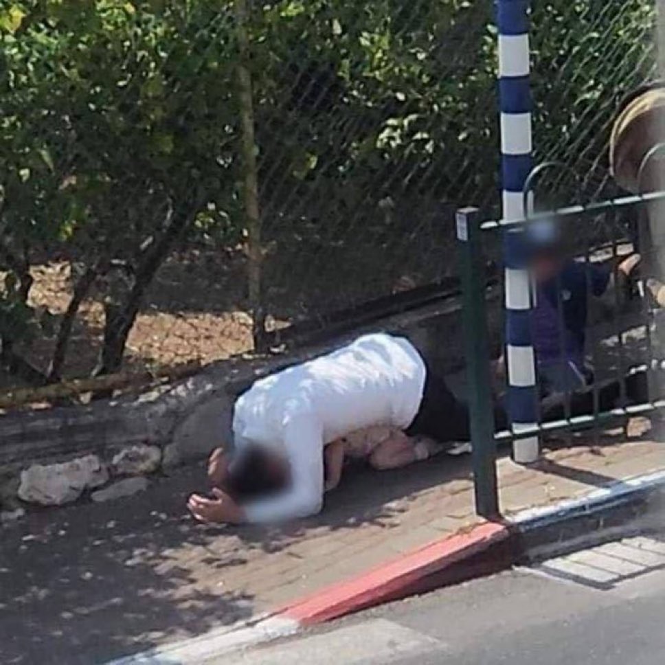 MarinaMedvin's tweet photo. Israeli father, on a playground with his child, shielding his daughter with his own body from Islamist rocket fire.

One group of people shields their children with their bodies; the other uses children as human shields. Choose your side wisely. I know I did. https://t.co/o3vAbyJrHQ