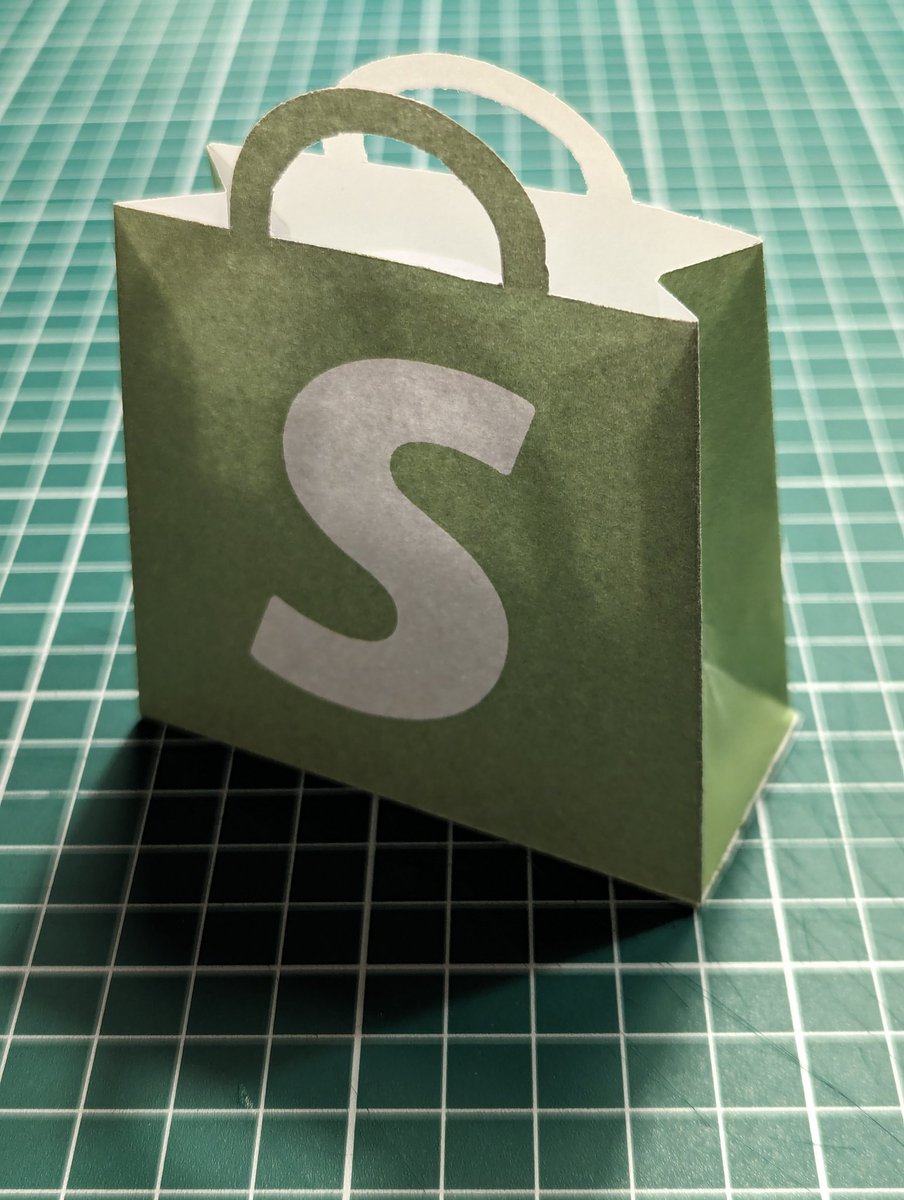 I recently came across some pictures of the <a href="/Shopify/">Shopify</a> milestones gift that is sent out to merchants that allowed me to update my paper version with proper measurements.
I still need to find a better tool to draw the template and some heavier stock paper, but happy with this update