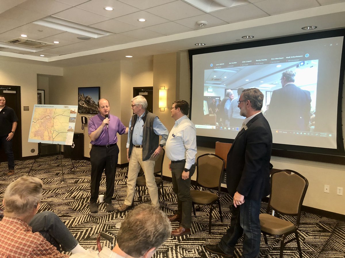 GreatDenTransit's tweet photo. The @GovofCO Jared Polis dropped in to the @Colo_Rail meeting for a hot minute to thank &amp; wish outgoing president #JimSouby a happy retirement.

Also pictured, @AndyKarsian from #BuildFRPR &amp; John Putnam from @ColoradoDOT. https://t.co/BXJwCOD27J