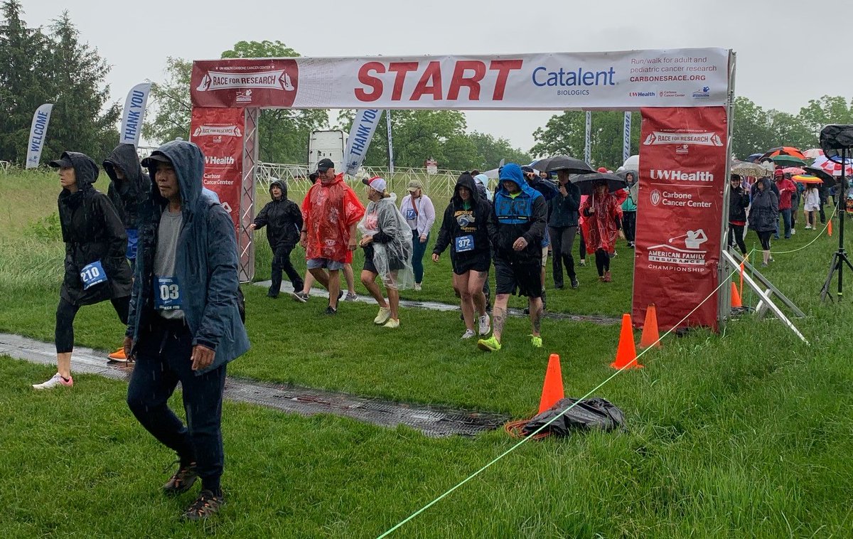 AmFamNews's tweet photo. First event of @AmFamChamp week, the @UWCarbone #RaceforResearch! A little rain (well a lot of rain!) didn't deter these runners/walkers from raising money for cancer research today! https://t.co/B55M8EsyRD