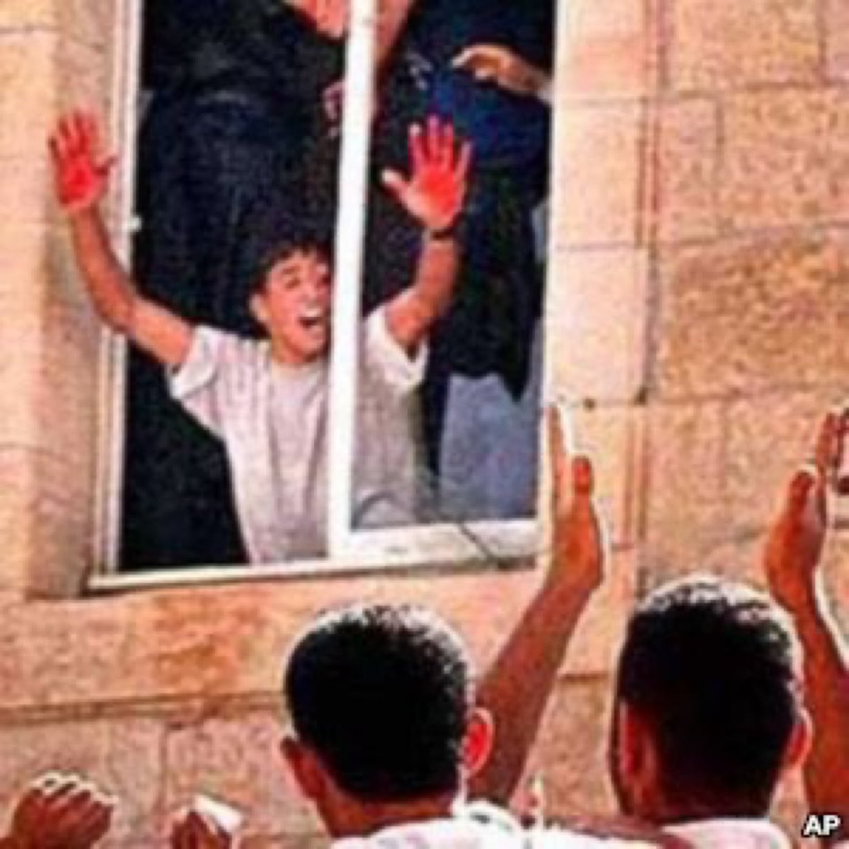 AzatAlsalim's tweet photo. In 2000 Israelis Vadim Norzhich &amp; Yossi Avrahami lost their way ended up in Ramallah where a mob set upon them,murdered and mutilated them.
One perp held his blood-soaked hands aloft in celebration. 
The crowd below cheered as one of the Israeli’s bodies was thrown out the window https://t.co/uunp0kK983