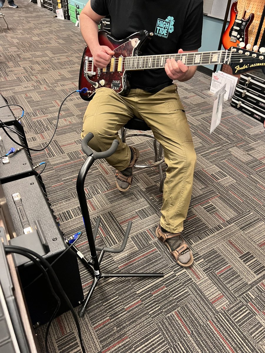 Took @RLFurryVideos out to Guitar Center. Watching him trying out a nice Jazzmaster! 🎸🐺😎