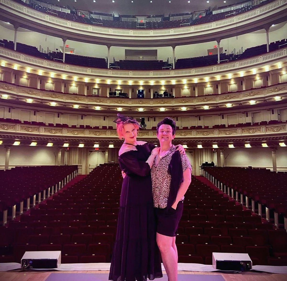 JinkxMonsoon's tweet photo. Last week, DeLa and I made a site visit to @carnegiehall—where next year, we’ll embark on a totally new adventure together with “Jinkx Monsoon: Live at Carnegie Hall” directed + co-written by @bendelacreme. It’s crazy that a friendship that started by choice (for fear of being bitter rivals, otherwise) has blossomed into a partnership that spans a decade. I’m really excited to be a queer artist at this time— mainly because of the family I’ve built and the community I serve. I love you all. Happy Pride. Blessed Be. 🖤🤘🏻🏳️‍🌈🏳️‍⚧️