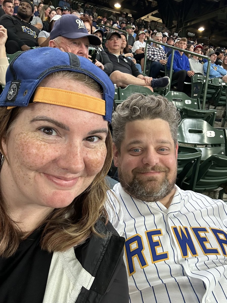 AmFamMarie's tweet photo. @ @AmFamField today- Dan is not impressed by my rally cap, but we got extra innings so I think it worked! ⚾️ https://t.co/ksssQOW5lZ