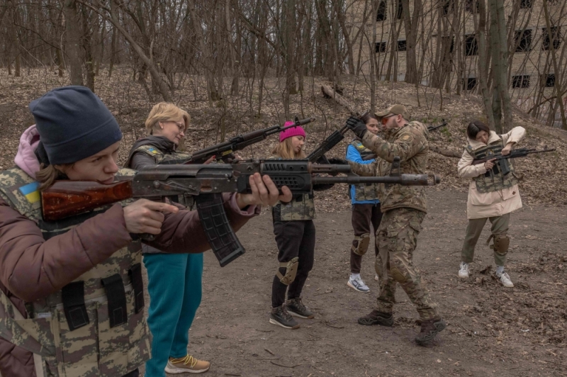 Ukrainian civilian women practice with weapons as they attend training focused on the use of weapons and combat medical kit in Kyiv in March 2024, amid the Russian invasion of Ukraine (Roman Pilipey/AFP)