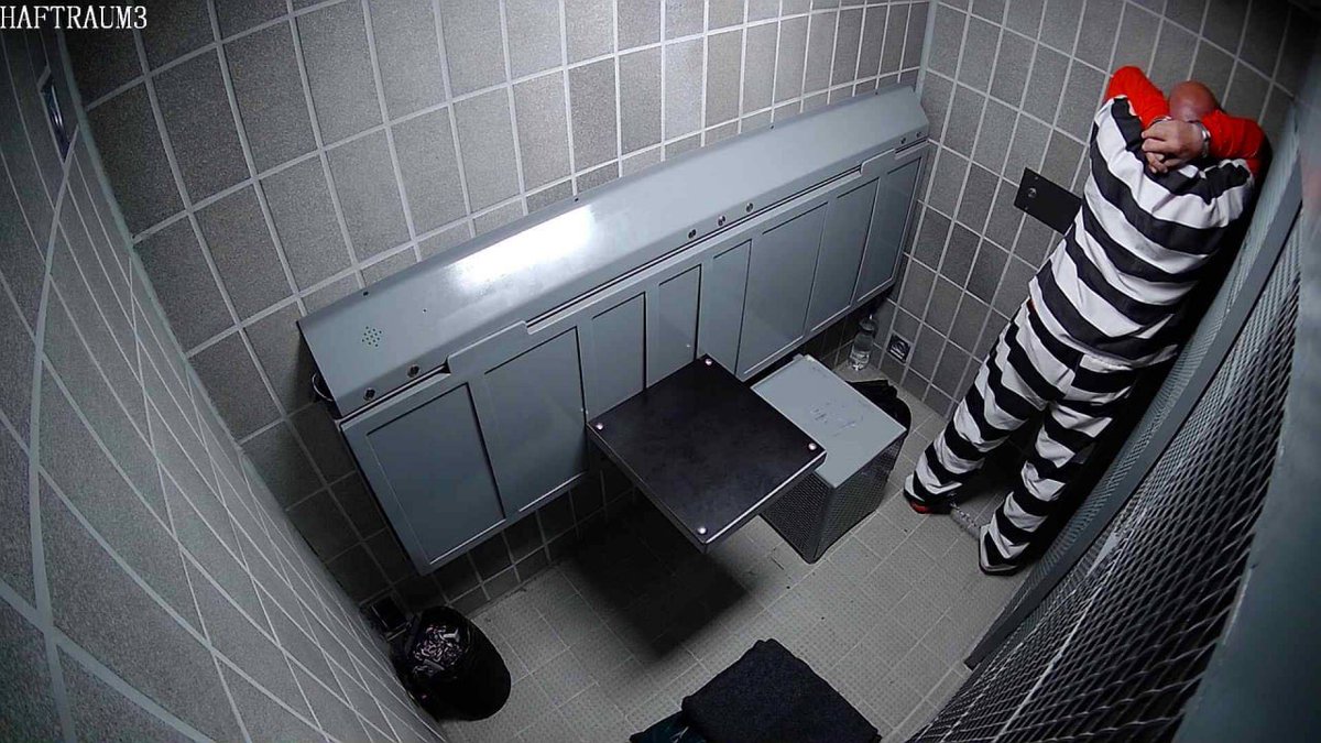 This morning in the cell. The light switches on, the command "Raise the bed" comes from the loudspeaker. Followed by the words "Prisoner in apell position"