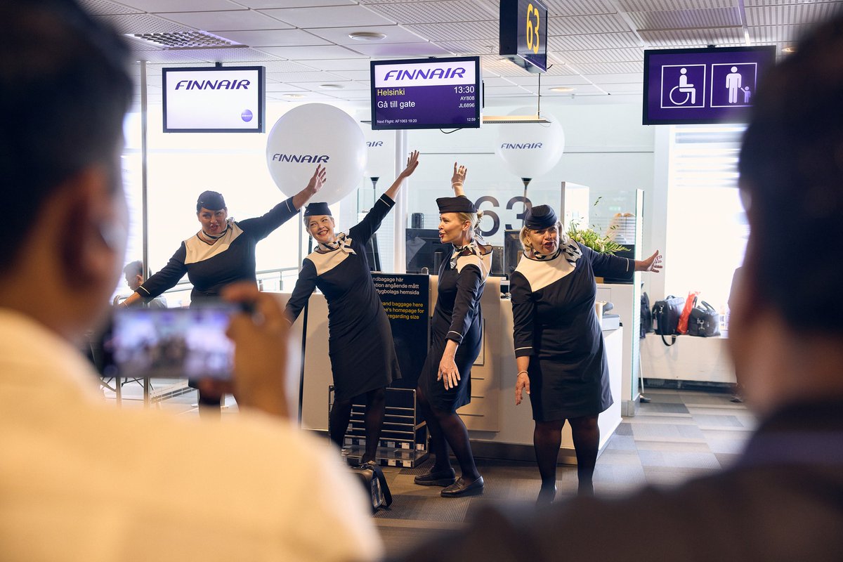 Finnair's tweet photo. It’s been 100 years since our first flight to Stockholm, Sweden. To celebrate this beautiful milestone, Finnair Singers and our flying pilot Mikael Konttinen delighted our customers by performing at Helsinki Airport and Stockholm Arlanda, and on selected flights yesterday. https://t.co/EmpcWvP25H
