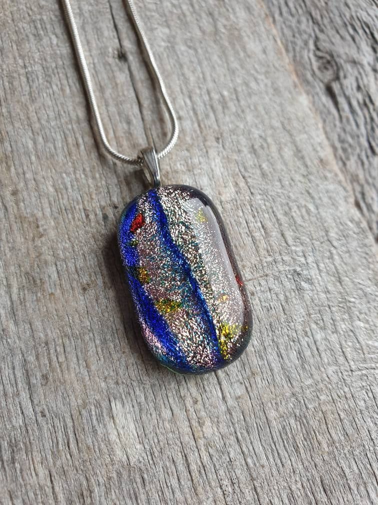 Beautiful sparkling silver, blue and hints of red and blues in this handcrafted necklace. Lovely handcrafted pendant. #handmade #etsy #shopindie #etsyuk buff.ly/452sxLo