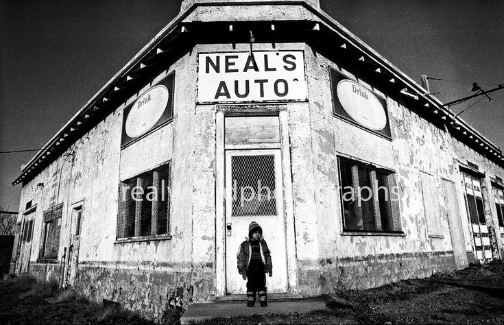 RealWorldImage's tweet photo. A boy stands at the entrance to an abandoned auto service station. Gleichen, Alberta. 1991. Gary Moore photo. Real World Photographs. #canada #photography #photojournalism #blackandwhite #nineties #realworldphotographs #garymoorephotography #gleichen #alberta #sweden #nikon https://t.co/5vyFoxWfbA