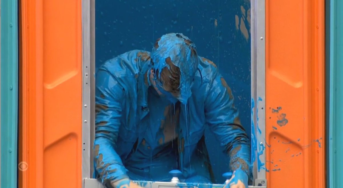 JamesTyson6's tweet photo. Big Brother US star Kyle Carpenter found himself gunged on the launch night. Made to sit in a porta potty, whoever was slowest to answer correctly would be slimed. 
Poor Kyle made it to the last question, but wasn't quick enough! Blue gunge covered him &amp; the his entrance clothes! https://t.co/K8WmJSSXEF