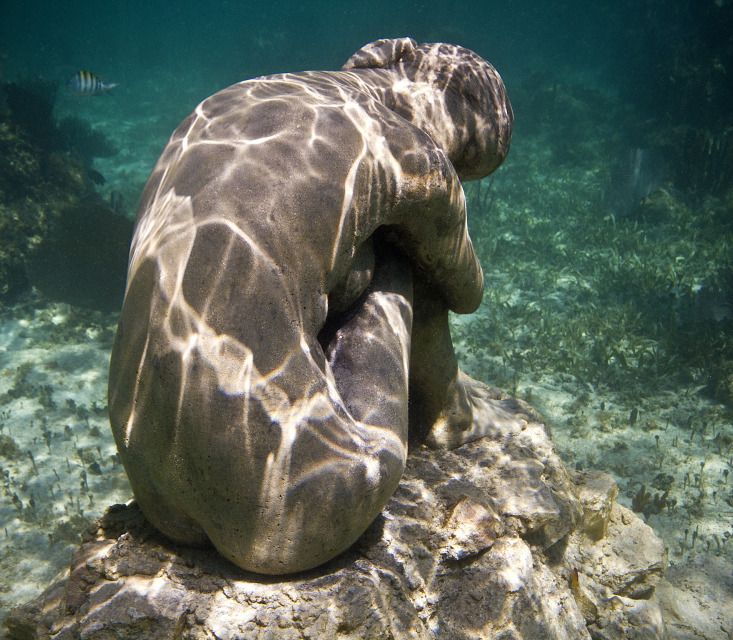 15. No Turning Back by Jason deCaires Taylor portrays a lone woman located just below the sea's surface. Her arched back is designed to capture the flickering rays of sunlight created by the undulating surface of the waves.

The sorrow depicted in this piece is a response to the