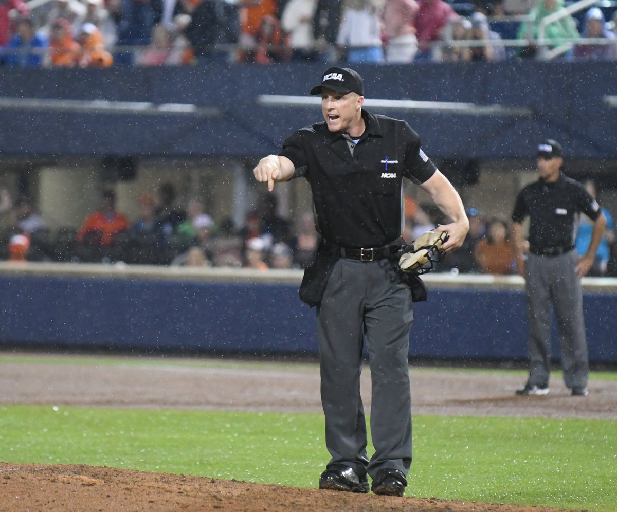 After two wild pitches, scoring two UVa runs, home plate ump Rick Allen demanded the grounds crew pour new dirt down on the mound. (Cal Tobias/@DailyProgress)