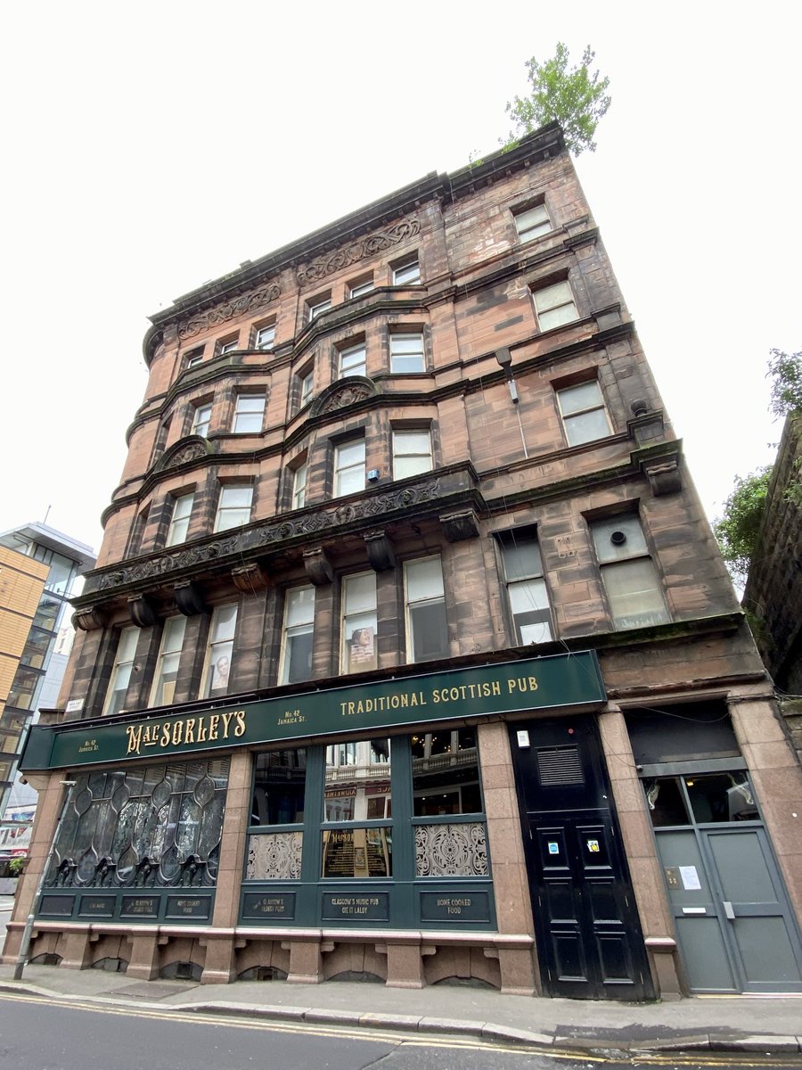#GlasgowHeritage stuff: Buddleja can be incredibly damaging. Sadly, the ‘B’ listed MacSorley’s pub building on Jamaica Street is a bad example in the city centre with a buddleja bush prising apart the stones at the top of the gable thus leading to water ingress 👀👇🫣! 1/2