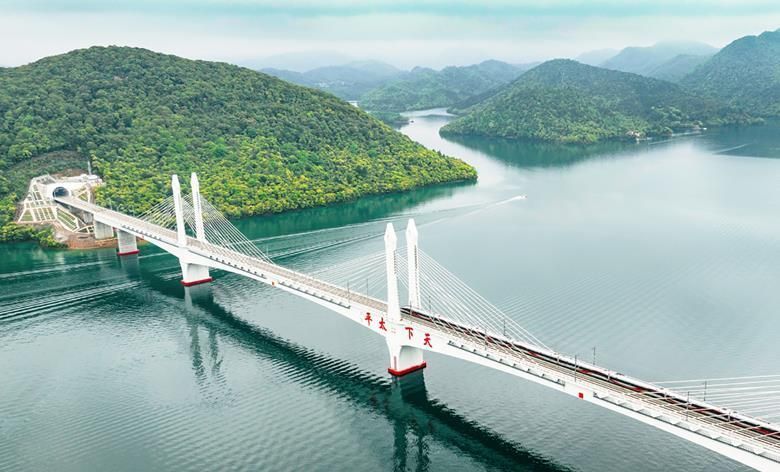 Rail conquer new heights - SAVEATRAIN.COM #heights #trains #chizhou #huangshan #bridge #river #china #longtrack