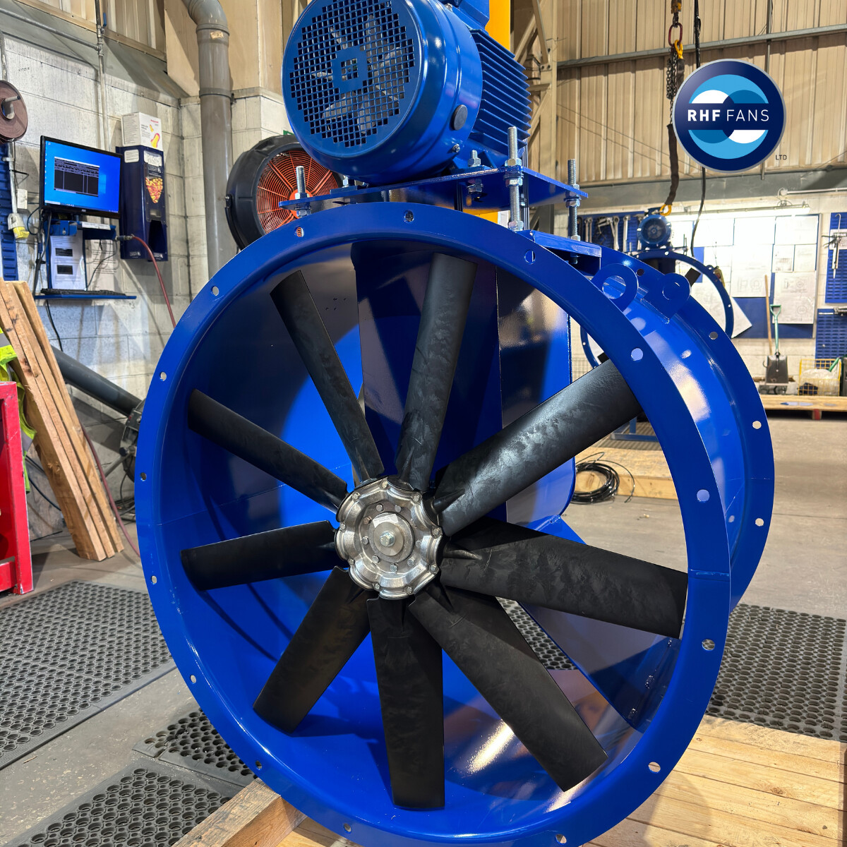 Belt driven axial fans are the go-to solution when the motor needs to stay out of the airstream, especially in warm or contaminated airstreams. 

Does it sound like you need a belt driven fan?