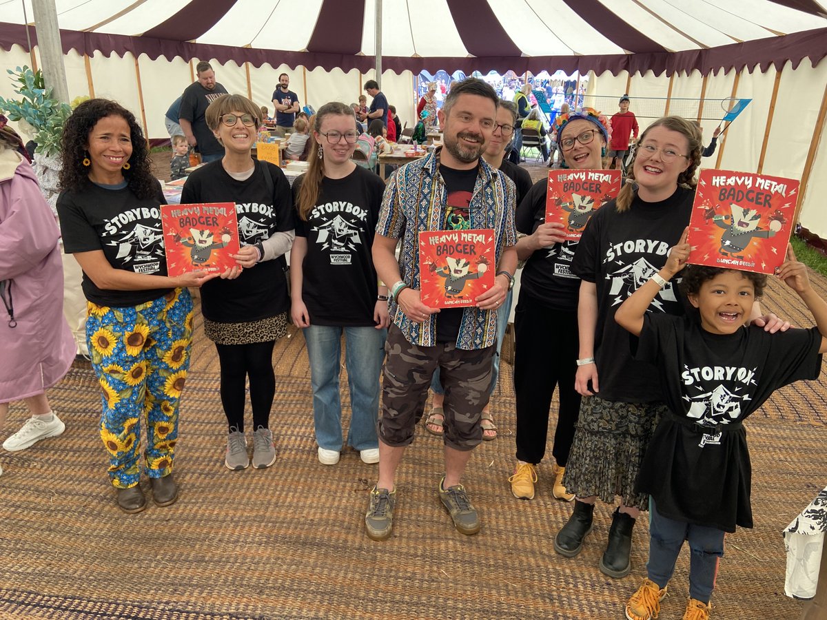 PhilipArdagh's tweet photo. It's the magnificent author/illustrator @DuncanDraws at the @WychwoodFestival with (most of) @bdotp's equally-marvellous #Storybox team, all sporting their HEAVY METAL BADGER T-shirts. What an amazing #wychwoodfestival it's been this year! @LittleTigerUK https://t.co/SLVJltxuqi