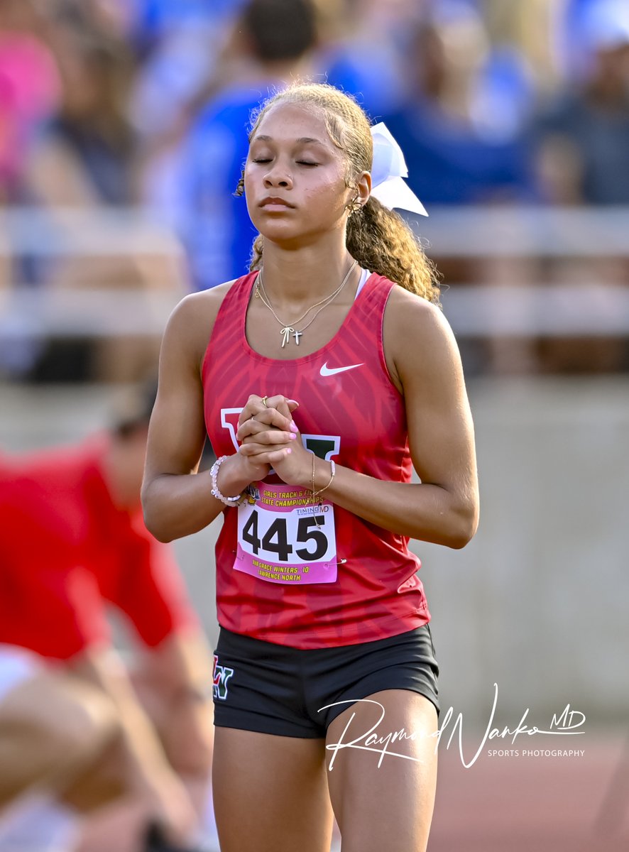 Lawrence North's Ava Grace Winters says a prayer before the 400m contest at the IHSAA State Finals Track &amp; Field Meet

<a href="/lnwildcats/">LN Wildcats</a>