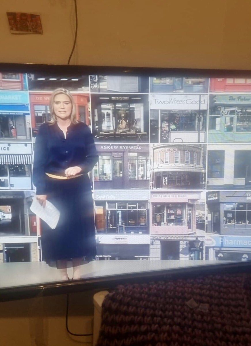 HistoryOfStokey's tweet photo. My Church Street shopfront poster used as backdrop in the BBC London evening news just now :) (photo by Patima Omar)

The 2:30min feature about my research into the history of every shop in Church Street, which the backdrop was used for, is available here till tomorrow afternoon. Starting at 5:40min: https://t.co/n8V1FS4LB8

All 10 annual editions of my Church St shopfront poster from 2015 are available here: https://t.co/ELFlRfaqM2