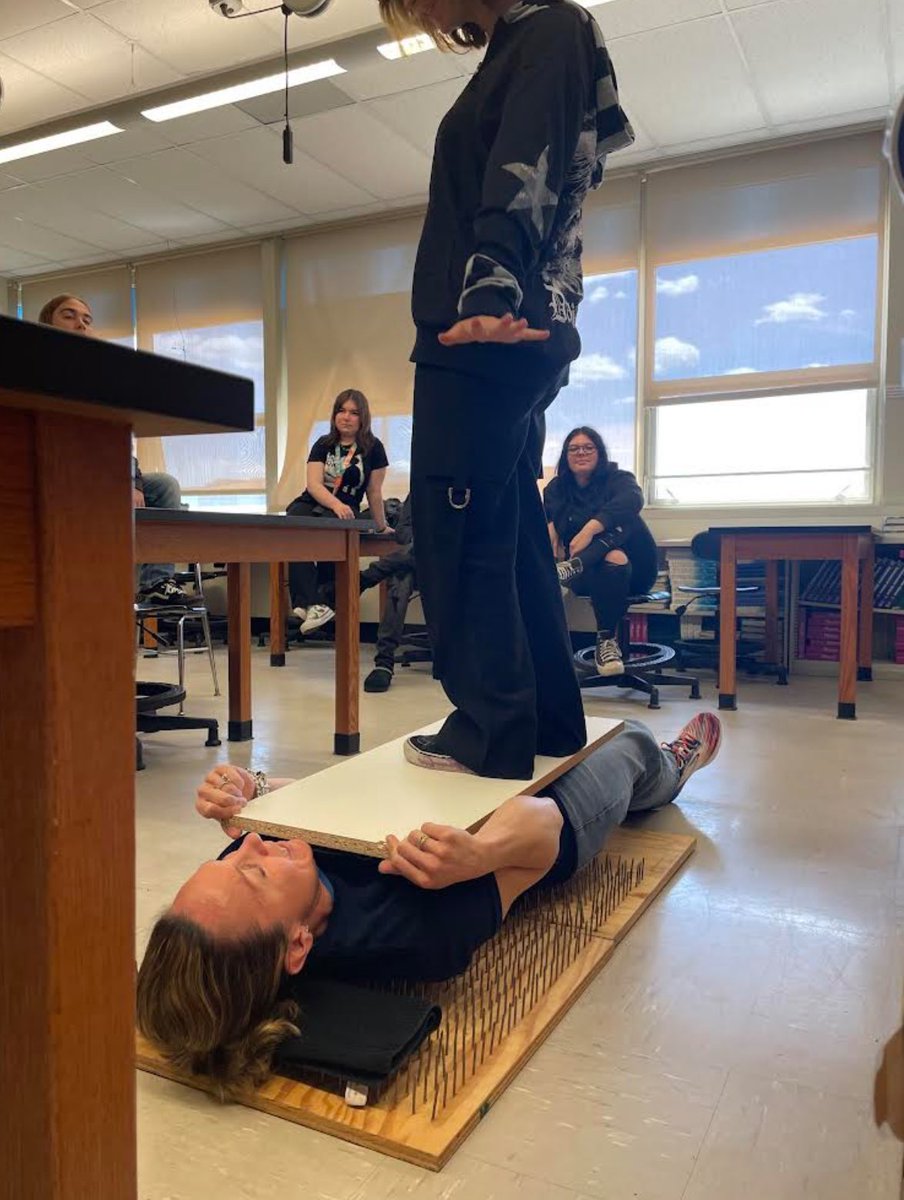 GloucesterGHS's tweet image. Mrs. Valentino’s Everyday Physics learned about Newton’s Laws of Motion by watching their teacher lay on a bed of nails. #LionsLearning