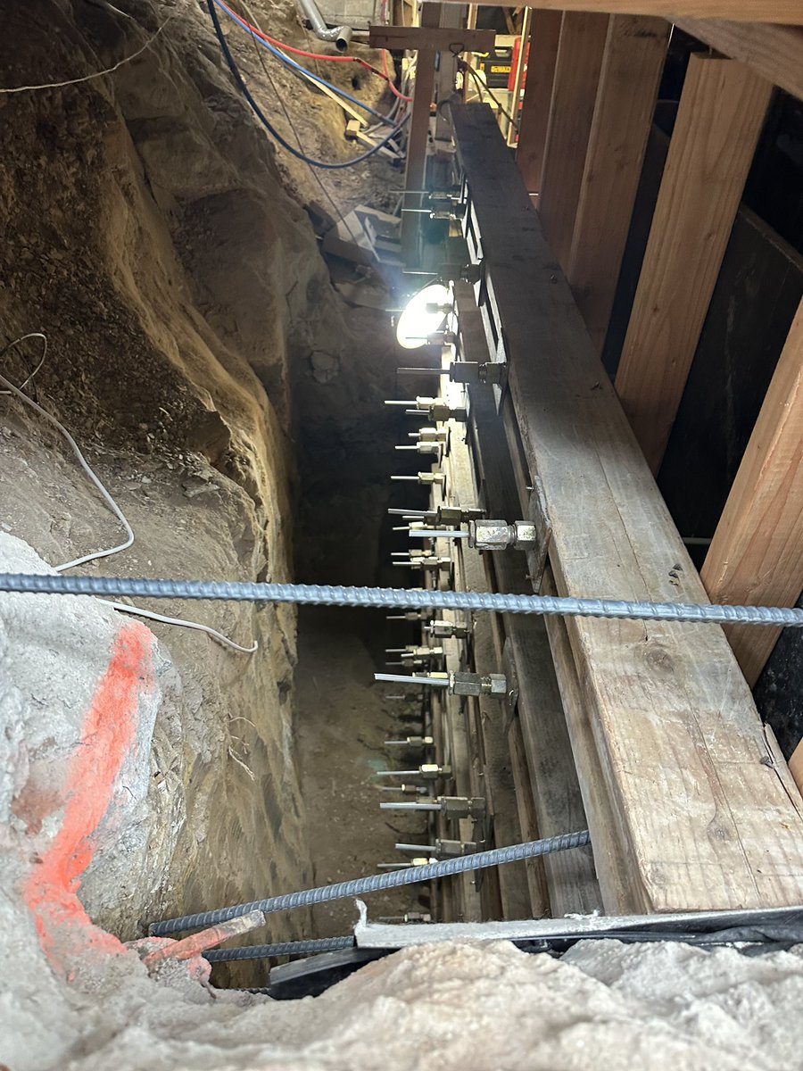 ConstructionRcw's tweet photo. This is what a 9’ high wall for a basement under an existing house looks like prior to concrete placement.  #basement #waterproofing #shoring #footing #progress #residential #trending #foundation #hillside #structuralsteel #build #retaining #wall #constructionsite #rcw #rcwcrew https://t.co/XscwxAzpFG