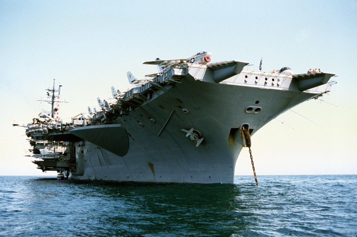 Boneyardsafari's tweet photo. Here is a look at USS America CV-66 in the early 1980’s, what is different about her compared to the rest of the Kitty Hawk class? #ussamerica #cv66 #a7 #s3 #flynavy #navalsafari #aviationsafari #aviationpreservation #boneyardsafari https://t.co/Qo15CFfyvW