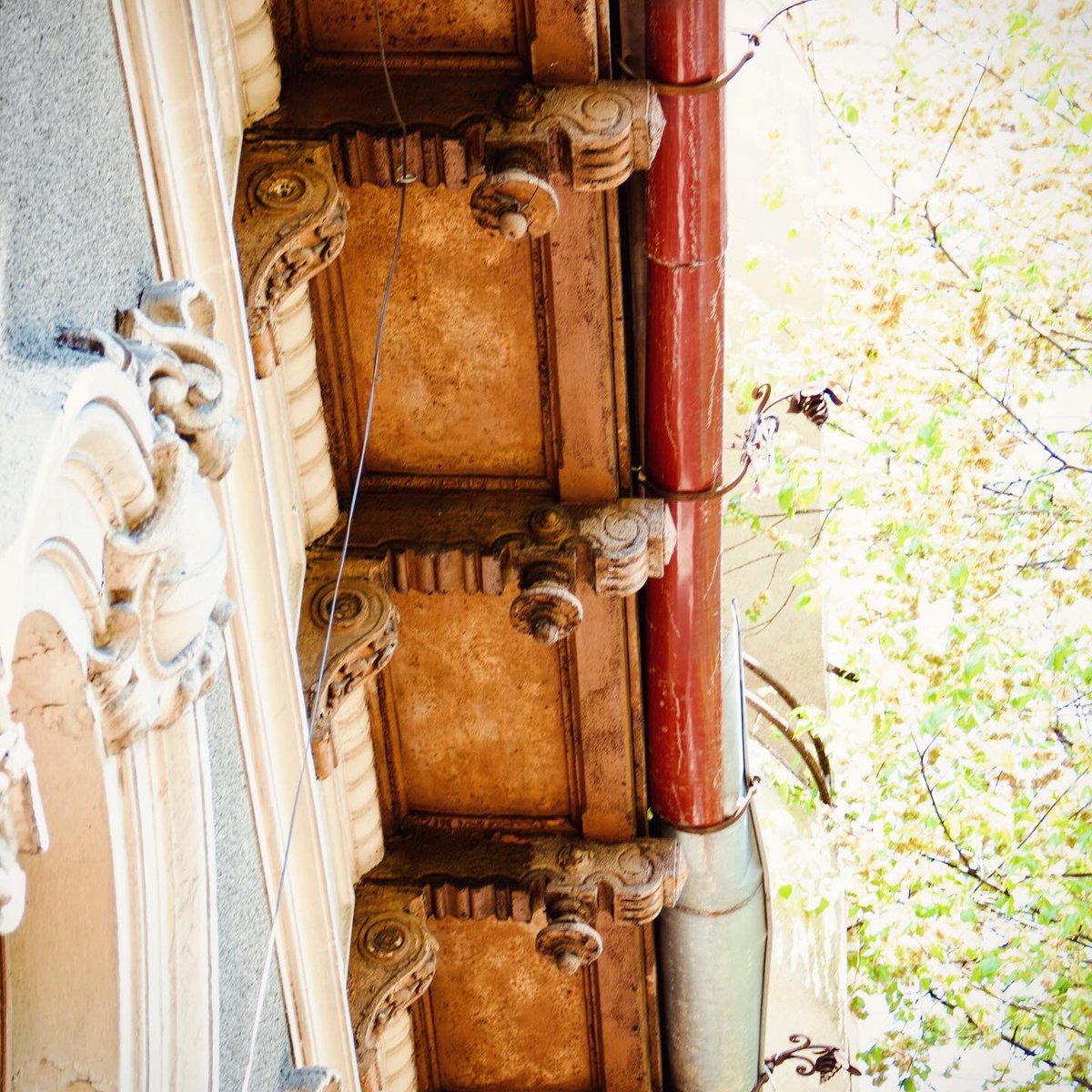 Fine woodwork of a Bucharest Little Paris style house built in the 1890s, in Carol Park area: door and roof eave corbels. #woodwork #littleparis #bucharest #balkans #southeasteurope #casedeepoca #valentinmandache